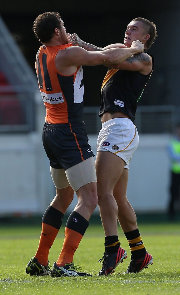 AFL 2014 Rd 10 - GWS Giants v Richmond Shane Mumford of the Giants and Dustin Martin of the Tigers come to blows during the 2014 AFL Round 10 match between the GWS Giants and the Richmond Tigers at Spotless Stadium, Sydney on May 24, 2014. (Photo: Craig Golding/AFL Media)